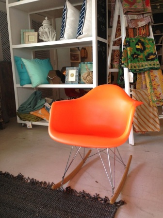 Have a seat in this modern orange rocker...